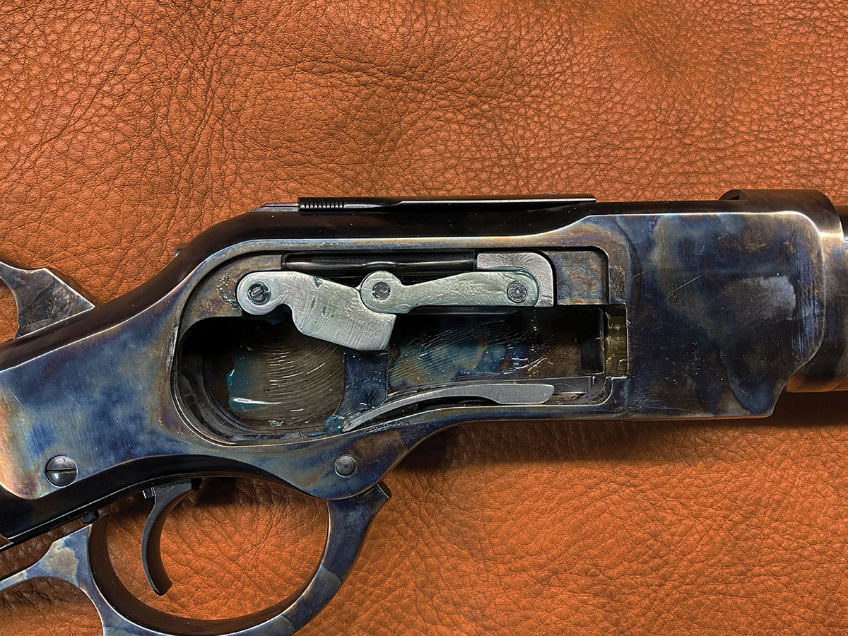 The TC73 uses a toggle-link system to operate the bolt and maintain forward thrust of the case head.